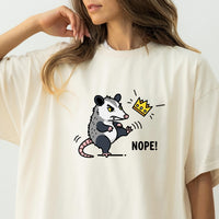 Nope Possum T-Shirt – No Kings Funny Graphic Tee – Grumpy Opossum Kicking Crown