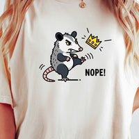 Nope Possum T-Shirt – No Kings Funny Graphic Tee – Grumpy Opossum Kicking Crown