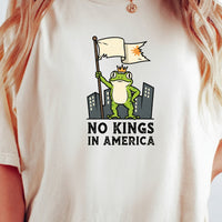 No Kings in America Frog T-Shirt – Rebellious Cartoon Graphic Tee – Funny Freedom Design