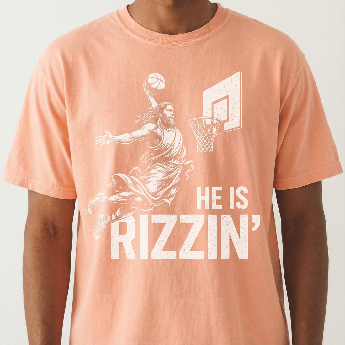 He Is Rizzin’ Funny Christian Basketball T-Shirt – Faith Humor Graphic Tee
