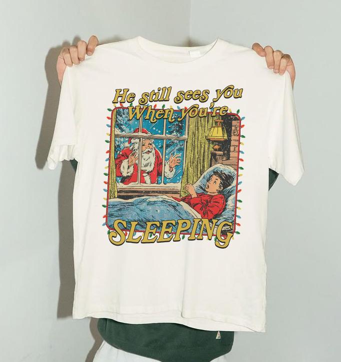 He Still Sees You When You’re Sleeping Shirt – Funny Horror Christmas Tee