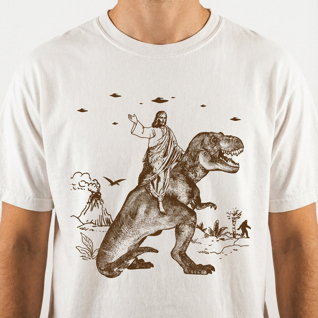 Jesus Riding Dinosaur Graphic T-Shirt - Funny UFO Novelty Tee